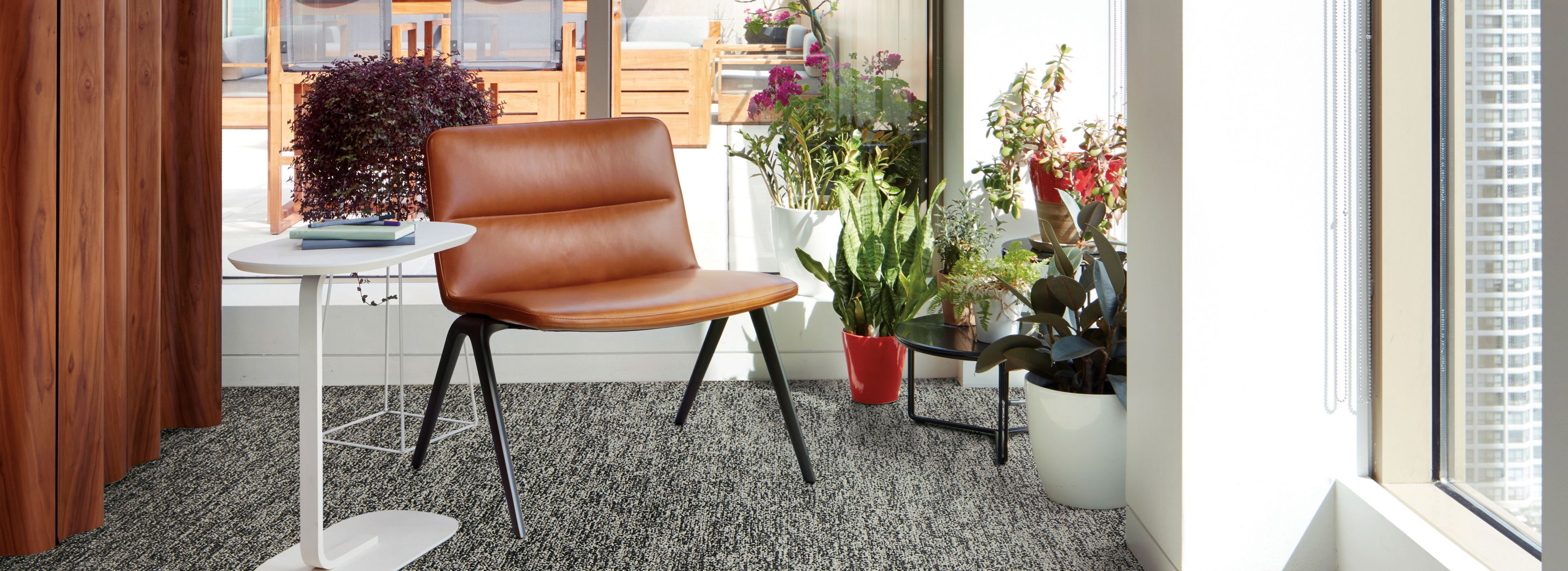 Interface Obligato plank carpet tile with leather chair and potted plants in windows imagen número 1